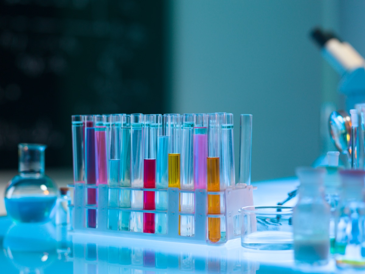 Chemical dye testing — coloured test tubes in quality control laboratory